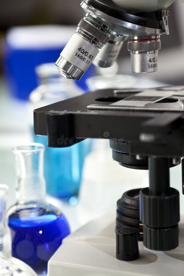 Microscope in a Science Laboratory with Flasks Stock Image - Image of ...