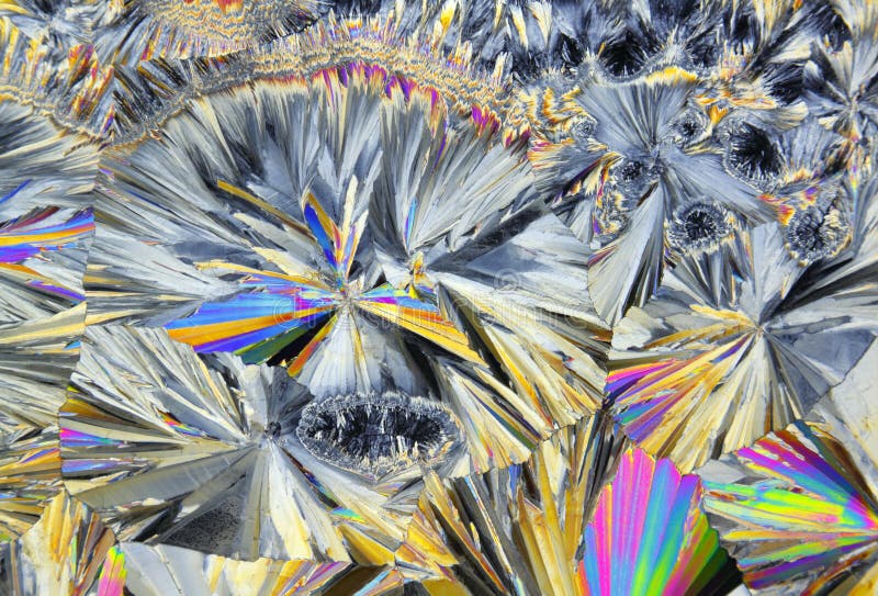 Microscopic view of sucrose crystals in polarized light royalty free stock photography Microscopic view of sucrose crystals in polarized light royalty free stock photography