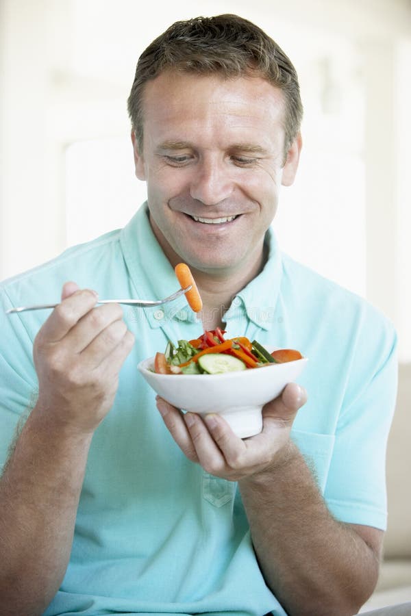 Mid Adult Man Eating A Salad stock photos Mid Adult Man Eating A Salad stock photos