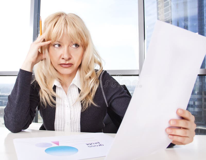 Mid adult woman work with documents