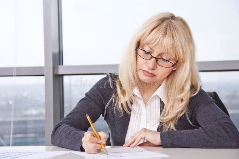 Mid adult woman work with documents