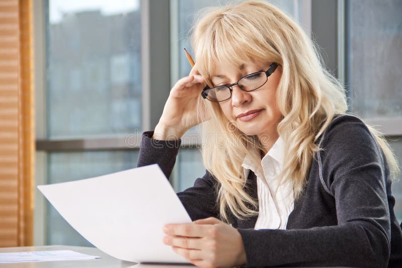 Mid adult woman work with documents