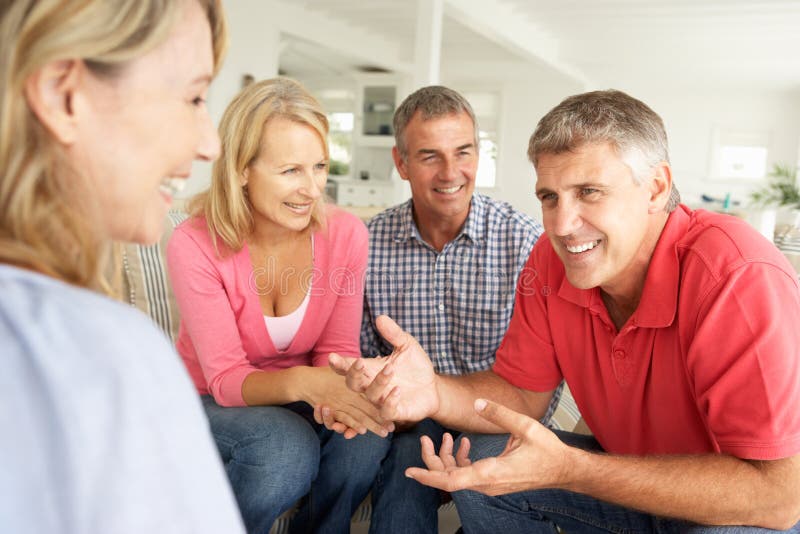 Mid age couples chatting at home royalty free stock photos Mid age couples chatting at home royalty free stock photos
