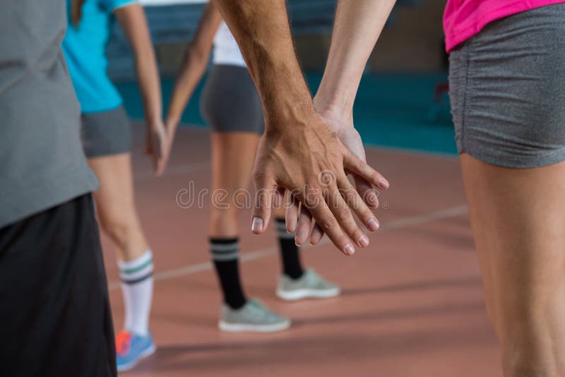 Mid Section of Volleyball Players Holding Hands Stock Image Image of