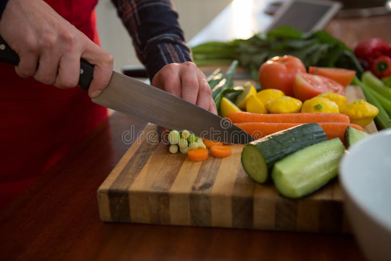 Mid Section of Woman Cutting Vegetable in Kitchen Stock Photo - Image ...