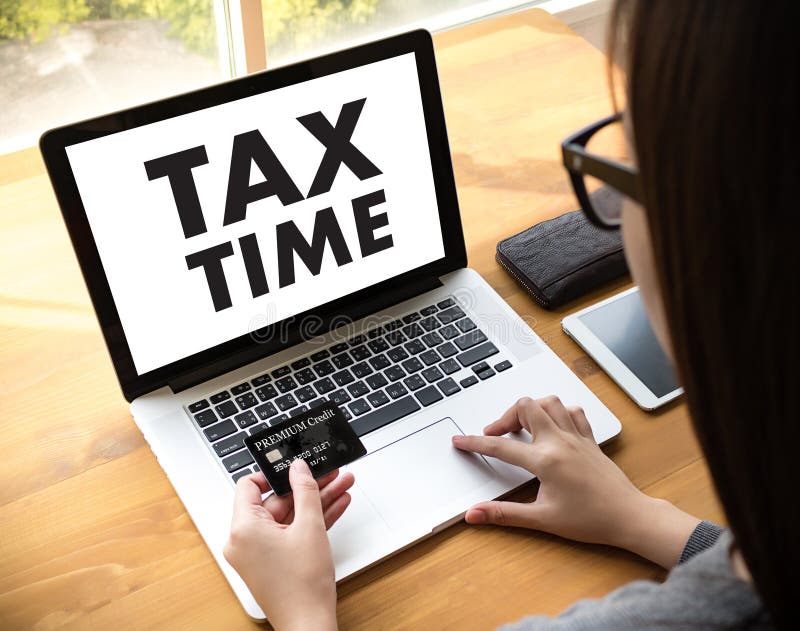 Mida el tiempo para los impuestos Busi de la contabilidad financiera del dinero de la gestión fiscal fotos de archivo Mida el tiempo para los impuestos Busi de la contabilidad financiera del dinero de la gestión fiscal fotos de archivo