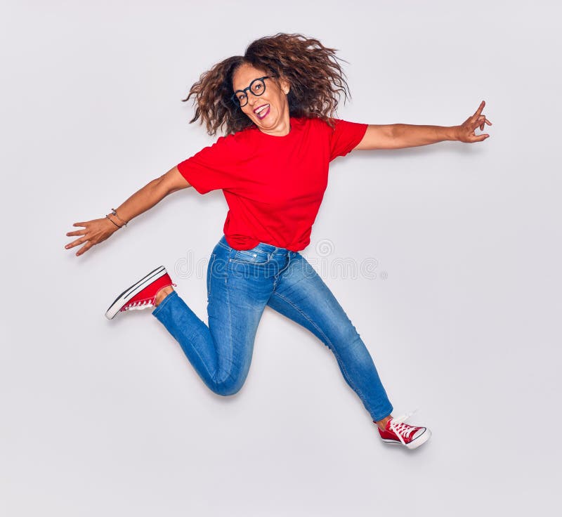 Middle age beautiful hispanic woman wearing casual clothes and glasses smiling happy