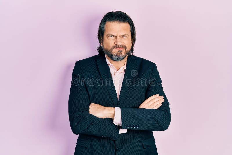 Middle age caucasian man wearing business clothes with arms crossed gesture skeptic and nervous, frowning upset because of problem