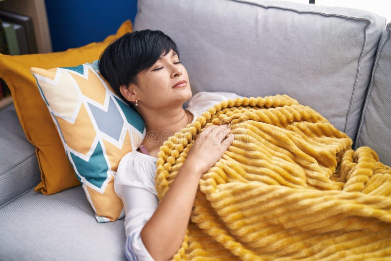 Middle Age Chinese Woman Lying on Bed Sleeping at Home Stock Image