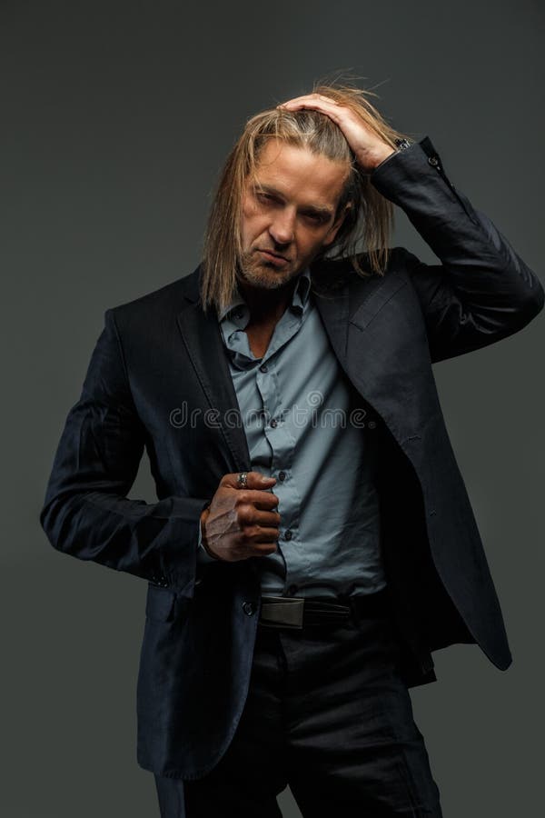 Long Hair Man in Suit Possing. Stock Image - Image of attractive, masculine: 108735269 Long Hair Man in Suit Possing. Stock Image - Image of attractive, masculine: 108735269