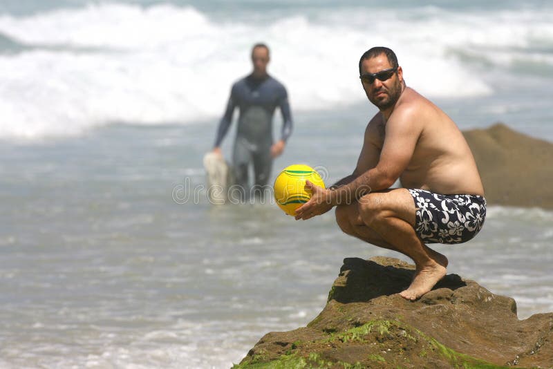 Middle age man playing with a ball