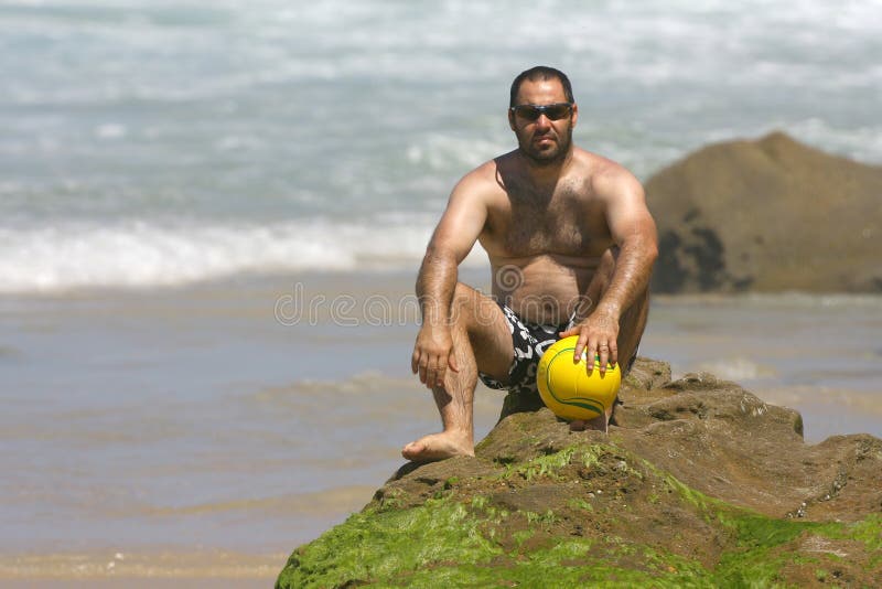 Middle age man playing with a ball