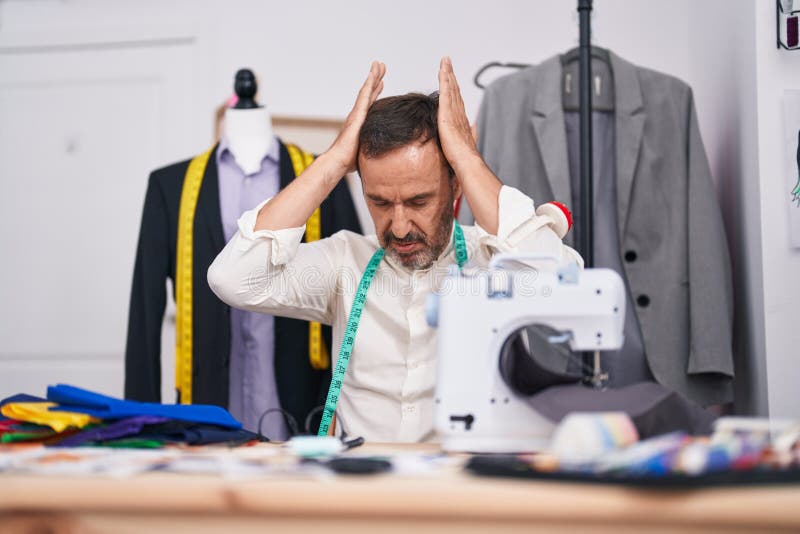 Middle Age Man Tailor Stressed Using Sewing Machine at Tailor Shop ...