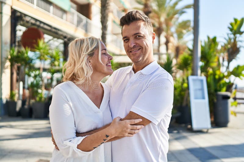 Middle Age Man and Woman Couple Hugging Each Other Standing at Street ...