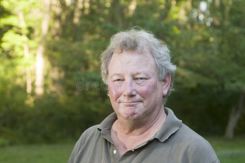 Middle age senior man in suburban backyard