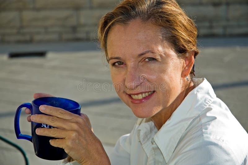 Middle Age Woman Drinking Coffee