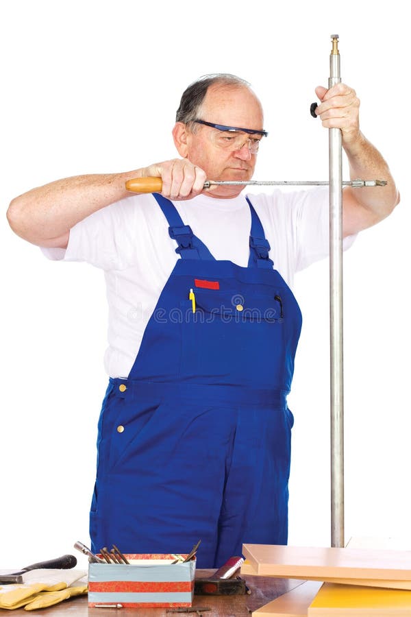 Middle age worker cutting metal pipe royalty free stock image