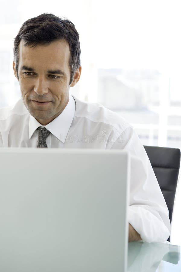 Middle Aged Businessman Arise In Another World Middle-aged Businessman at Workplace Stock Image - Image of internet