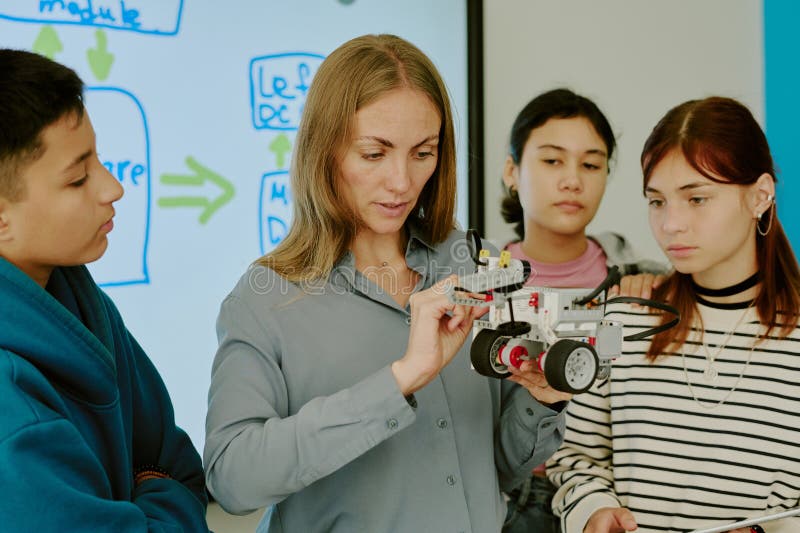 Teacher Telling About Robot Parts stock photography
