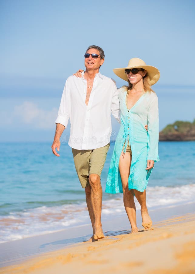 Middle Aged Couple Enjoying Walk on the Beach