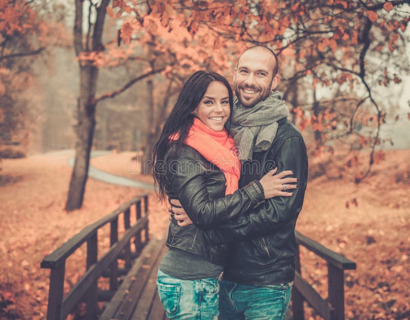 Middle-aged couple outdoors on autumn day