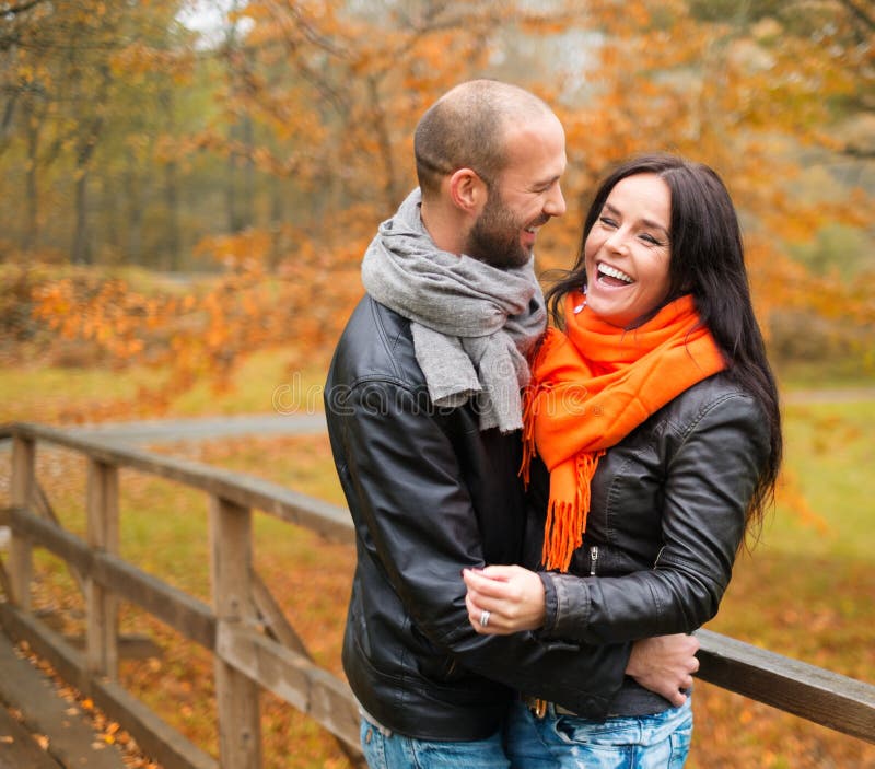 Middle-aged couple outdoors on autumn day