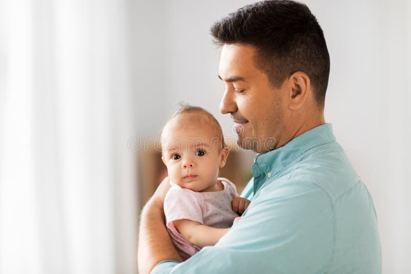Middle aged father with baby daughter at home royalty free stock image Middle aged father with baby daughter at home royalty free stock image