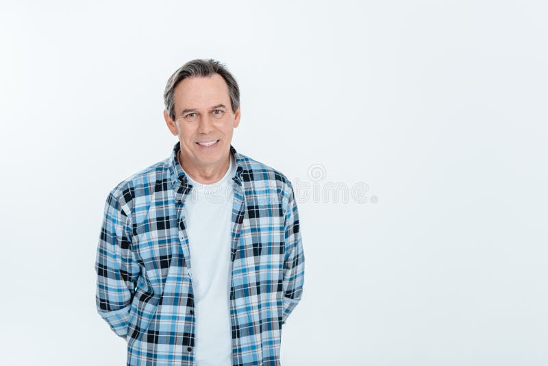 Middle aged handsome man smiling on white with copy space stock photos Middle aged handsome man smiling on white with copy space stock photos