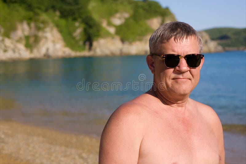 The Runaway And Middle Aged Man Middle aged man on beach stock photo. Image of person - 24052438