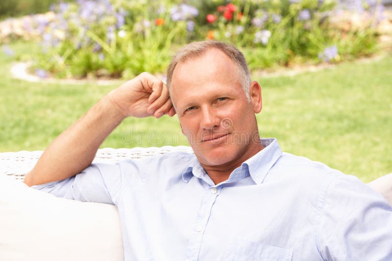 Middle Aged Man Relaxing in Garden Stock Image Image of home