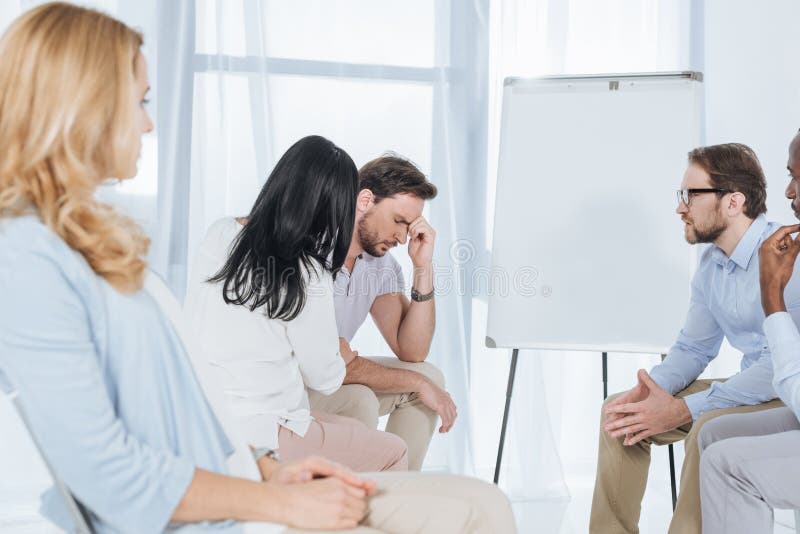 middle aged multiethnic people supporting each other during stock images middle aged multiethnic people supporting each other during stock images