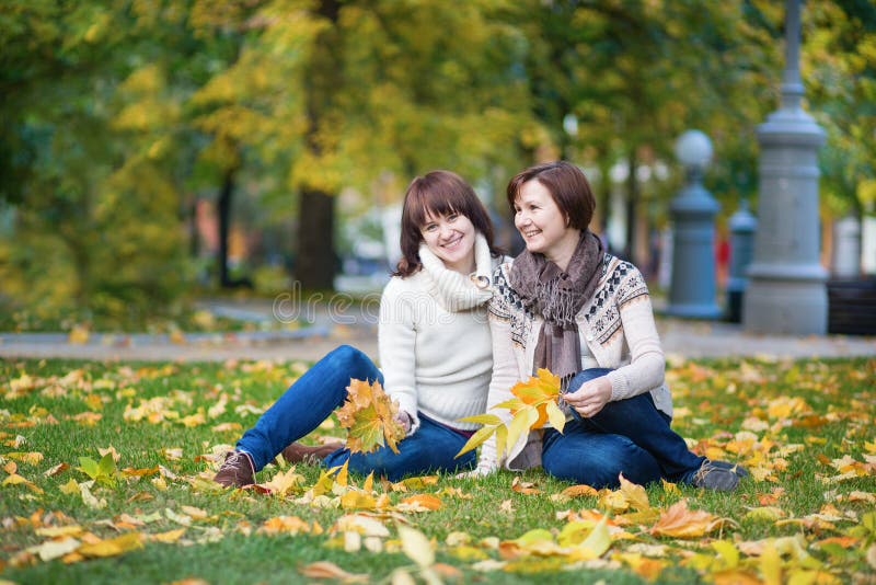 Middle aged woman with daughter on a fall day