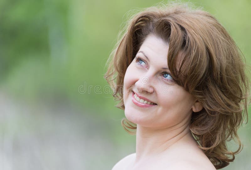 middle-aged woman in the summer park