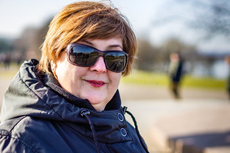 Middle-aged woman in sunglasses royalty free stock images Middle-aged woman in sunglasses royalty free stock images
