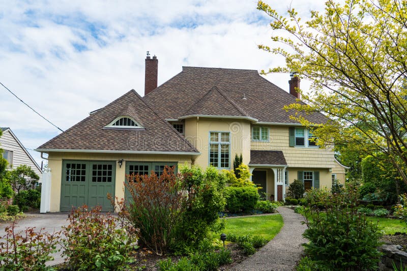 Middle-class Yellow House with Landscaping in Front Yard Stock Photo ...