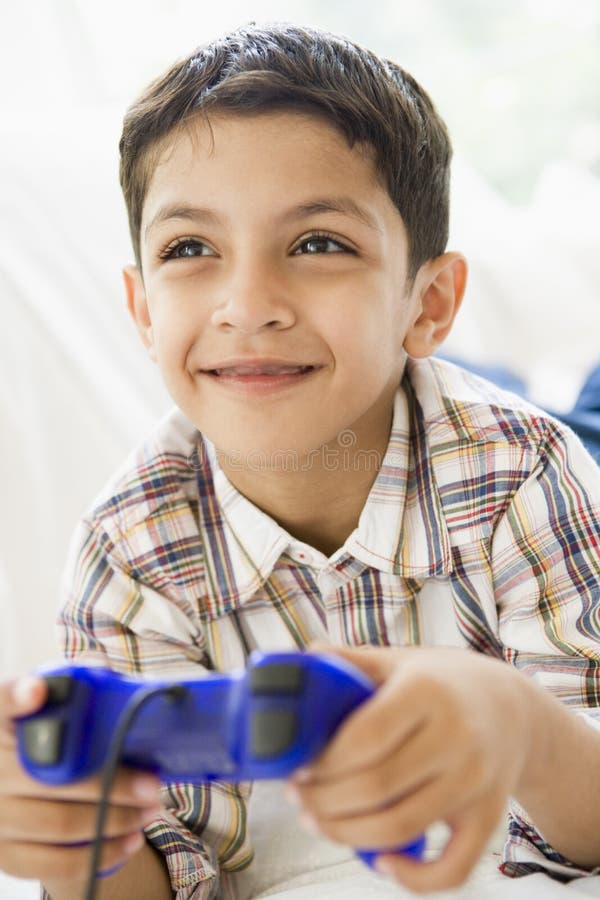 Middle Eastern boy playing a video game