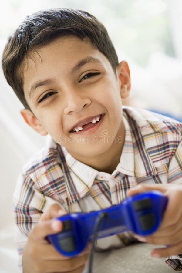 Middle Eastern boy playing a video game royalty free stock images