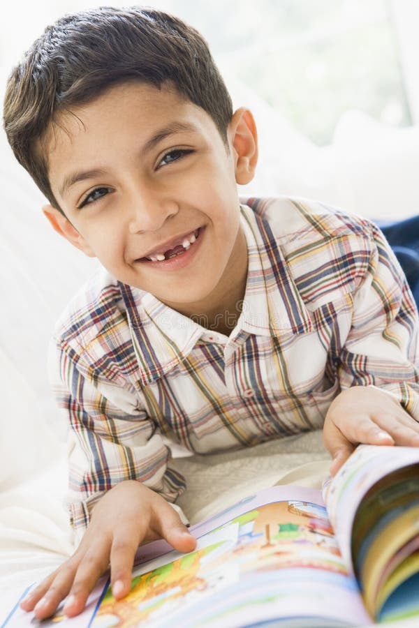 Middle Eastern boy reading royalty free stock photos