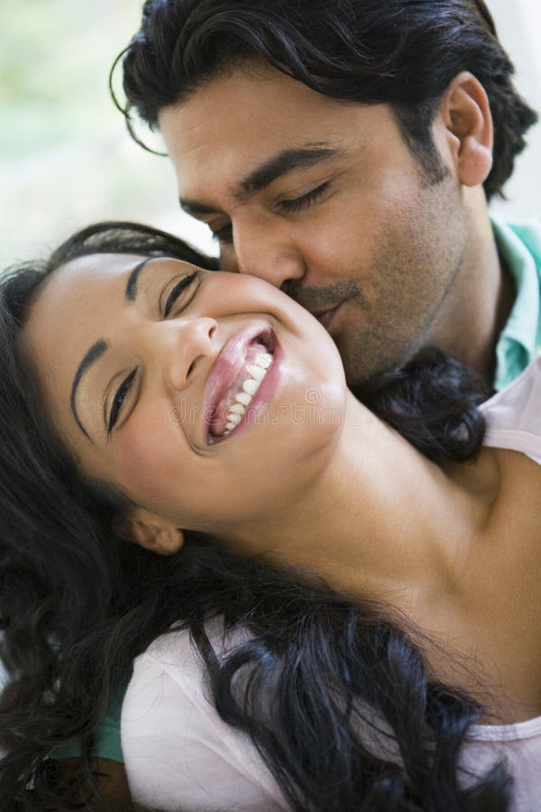 A Middle Eastern couple cuddling royalty free stock image