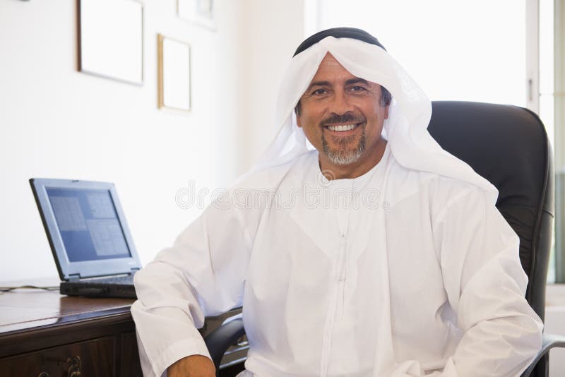 Download A Middle Eastern Man In Front Of A Computer Stock Photo - Image of laptop, looking: 6079454