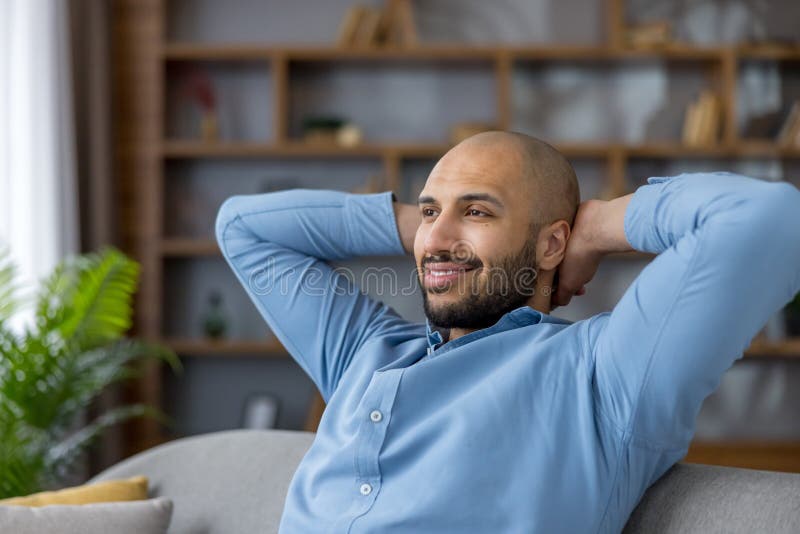 Relaxed man resting at home having a break stock photos