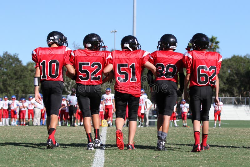 Middle School American Football Team Captains Take the Field for Coin Toss