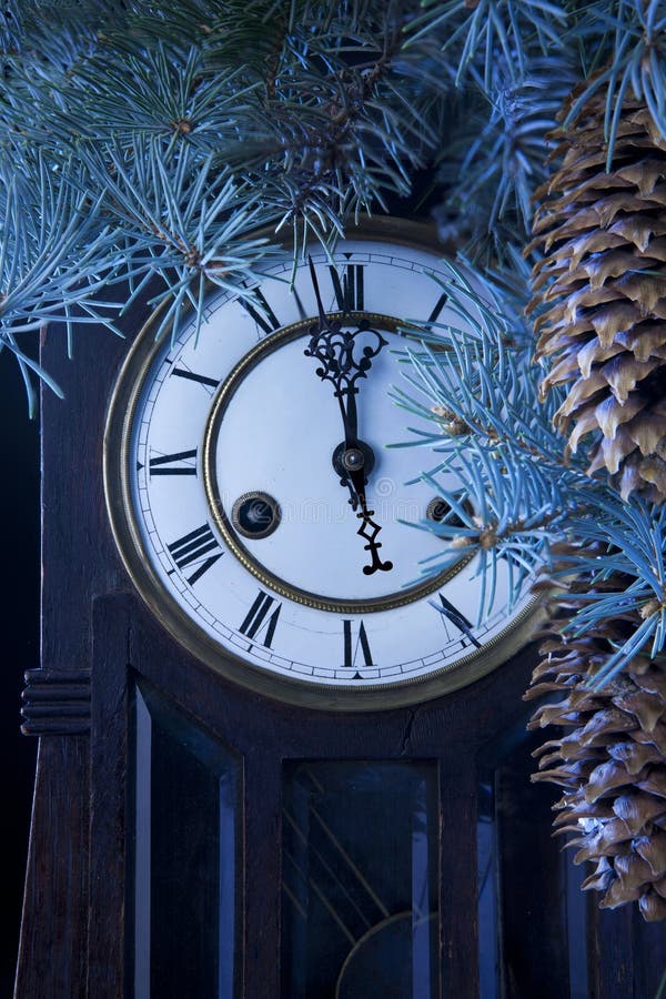 Midnight antique clock and a Christmas tree