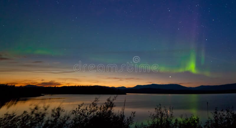 Midnight summer Aurora borealis Northern lights