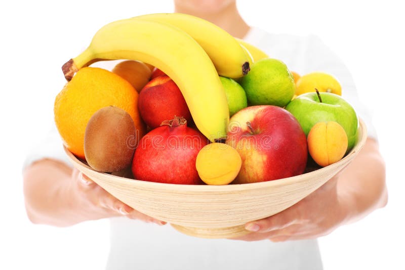 Midsection de una mujer que sostiene las frutas imágenes de archivo libres de regalías Midsection de una mujer que sostiene las frutas imágenes de archivo libres de regalías
