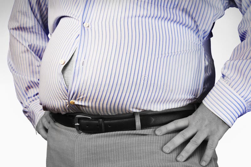 Closeup midsection of an overweight man standing with unbuttoned shirt and hands on hip. Closeup midsection of an overweight man standing with unbuttoned shirt and hands on hip