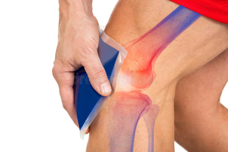 Midsection of man holding cool gel pack on knee for pain relief over white background. Midsection of man holding cool gel pack on knee for pain relief over white background