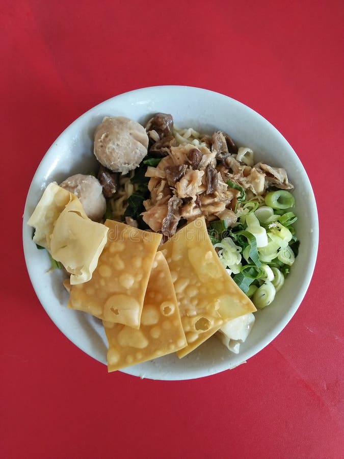 `Mie Ayam Bakso` Chicken Noodle Meatballs Soup. One of the most popular street food in Indonesia. It can be found almost every where in Indonesia.