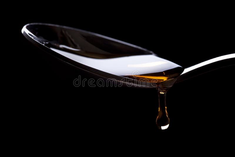 Miele fresco sul cucchiaio fotografia stock libera da diritti Miele fresco sul cucchiaio fotografia stock libera da diritti