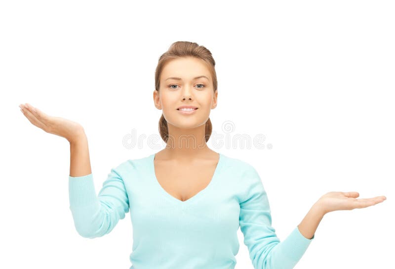 Woman measuring something on the palms of her hands. Woman measuring something on the palms of her hands